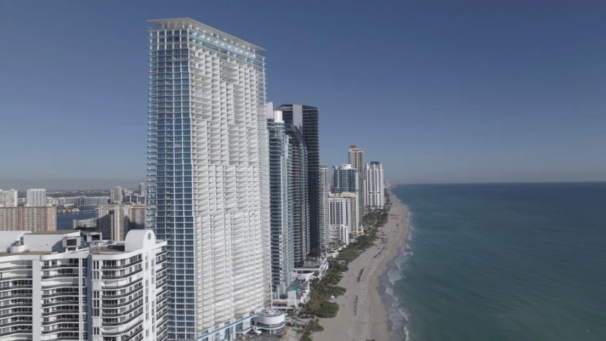 high rise building in the ocean near a beach