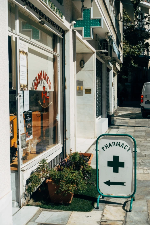 an arrow sign stands in the foreground as cars drive by