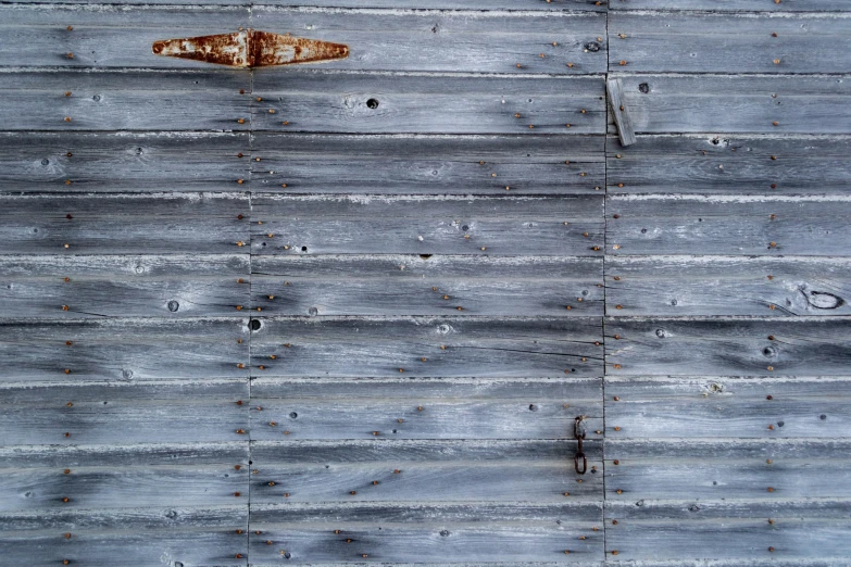 an old rusty piece of wood with rust on it