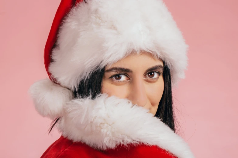 a person with a beard and wearing a santa hat