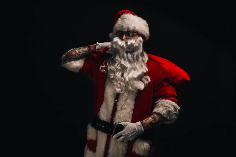 a person dressed up as santa clause holding a drink