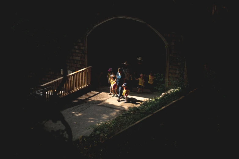 a group of people standing under an arch