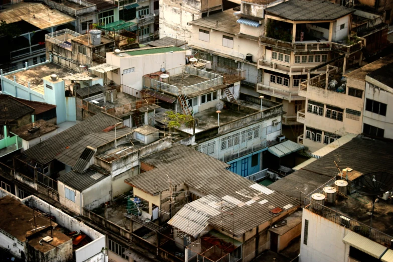 old houses are in a city area, one of the floors is torn off