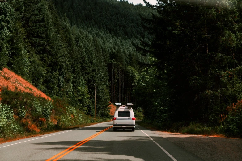 the car is going down the mountain road