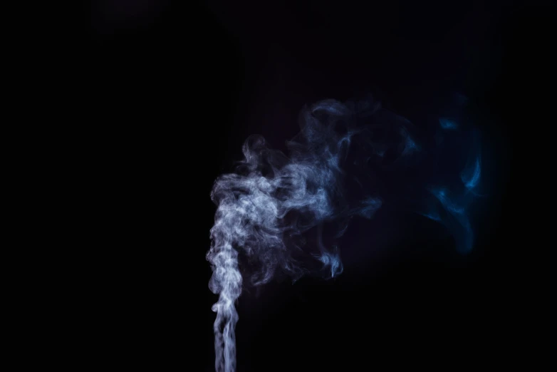 an image of smoke that is on the black background