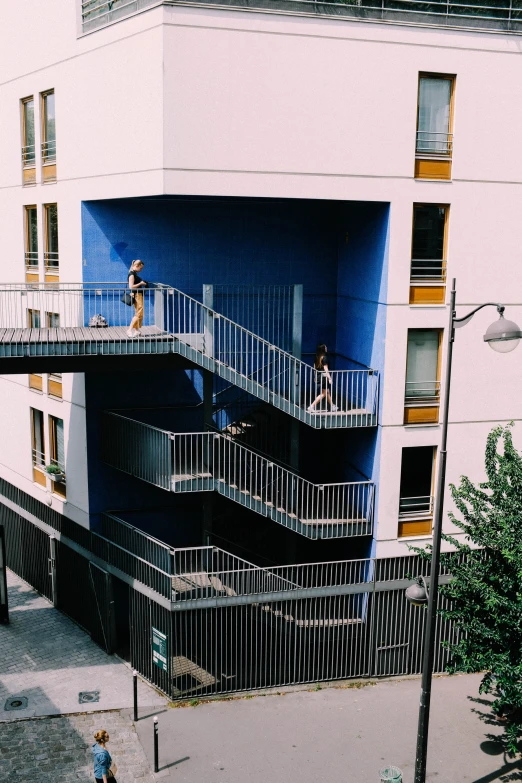 the building's balcony is next to a staircase