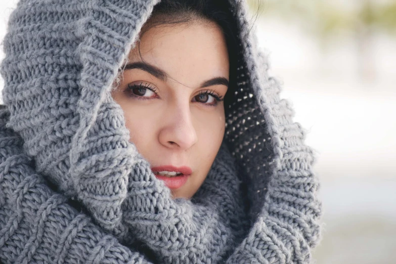 woman in gray wool scarf posing for the camera