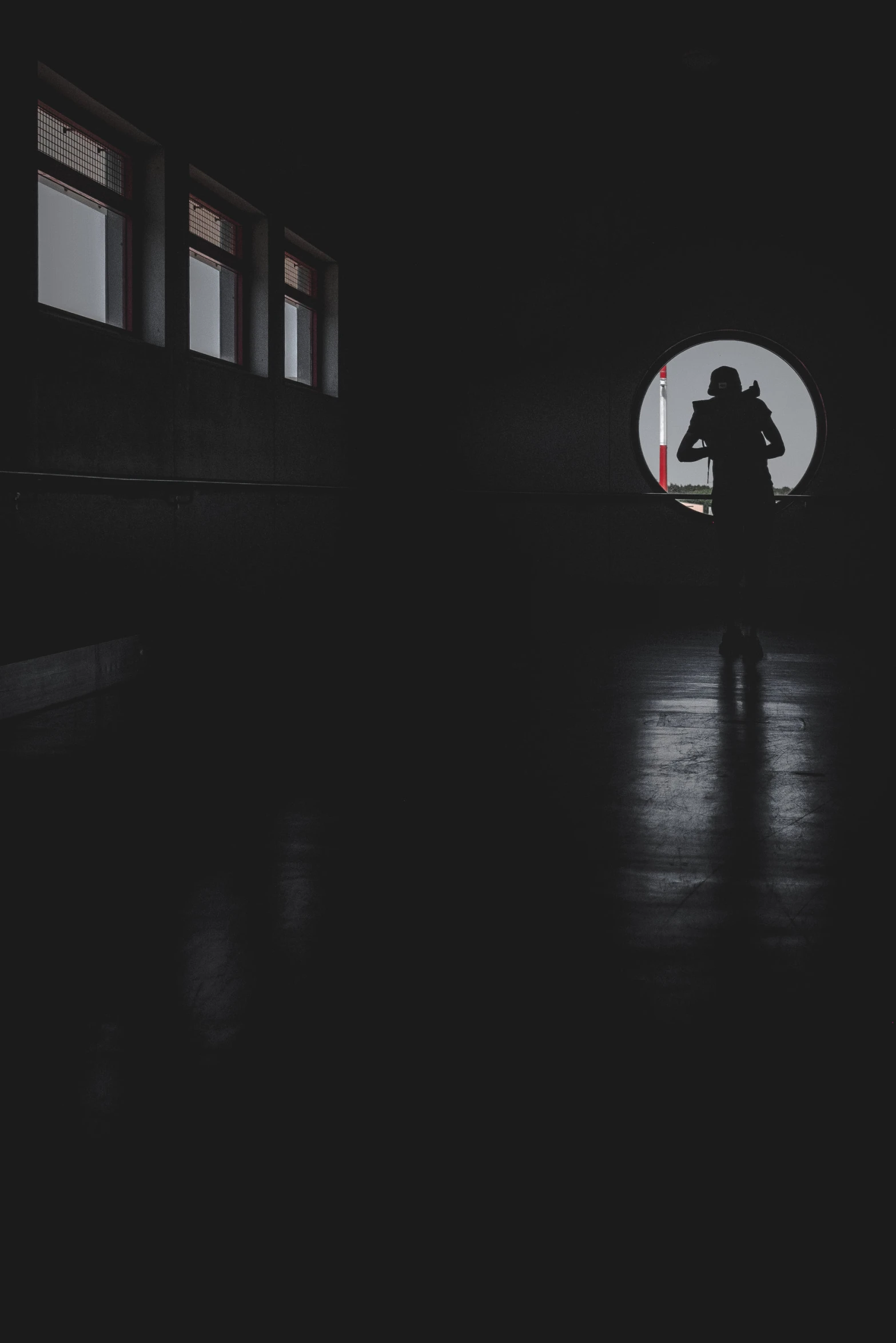 a person walking down a street in the dark