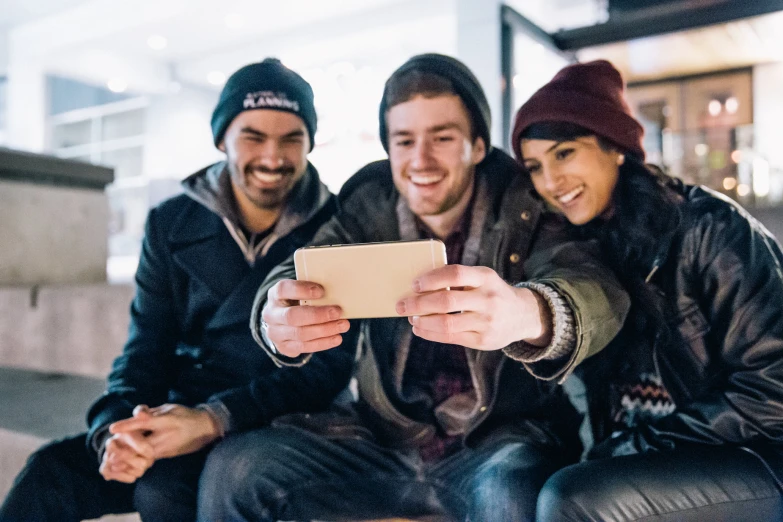 two people are taking a po on a tablet