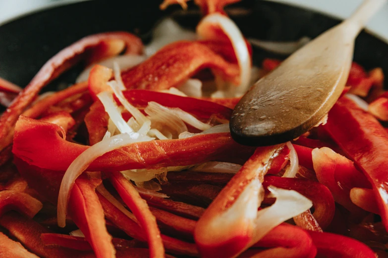 the food is cooking in the pan and ready to be cooked