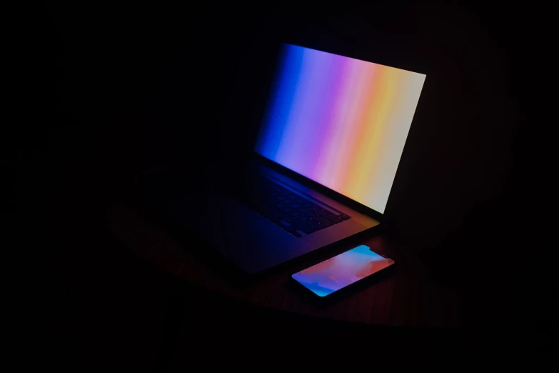 a laptop computer sitting on top of a table