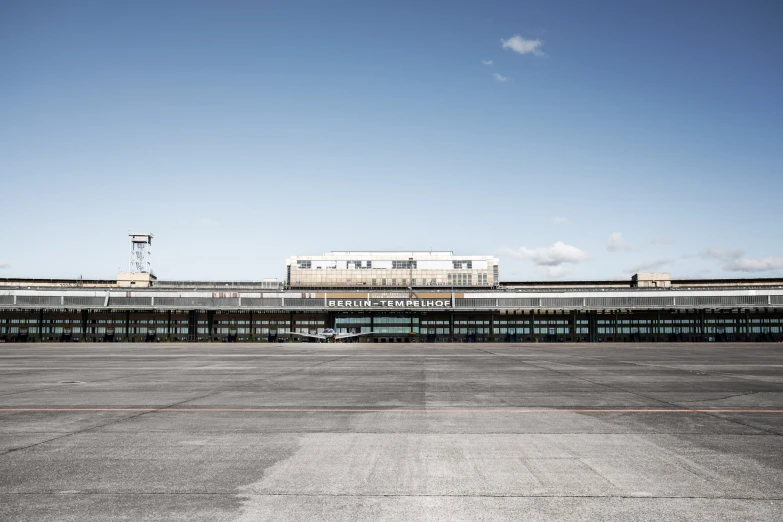 an airport with a train on the track