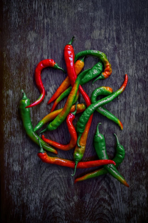 several different colored peppers are arranged together