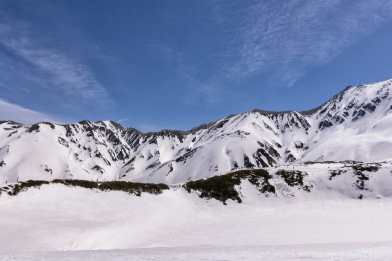 the snow covered mountains have no much white snow