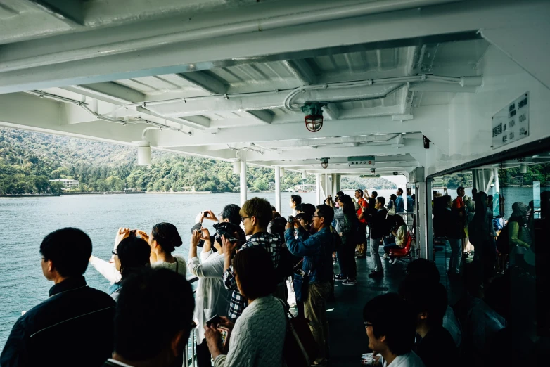 passengers on a ferry ride on a body of water