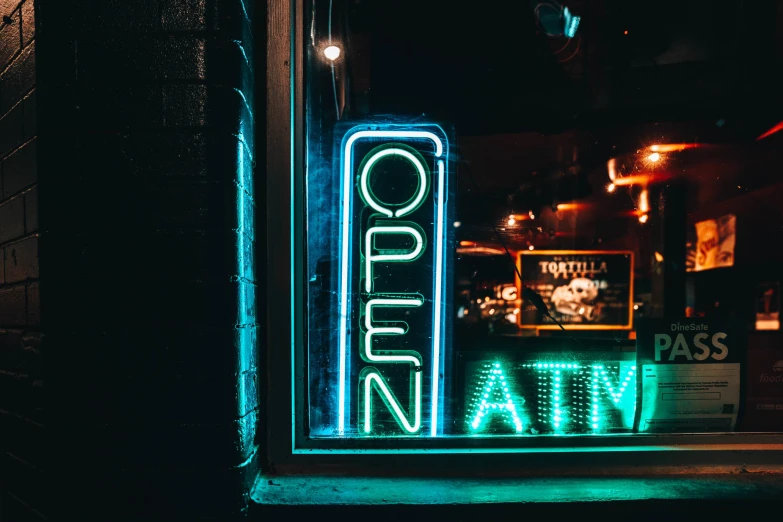 a neon sign is shown in the dark