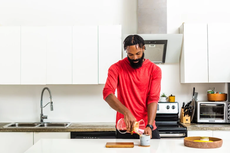 a man with beard and glasses is preparing soing