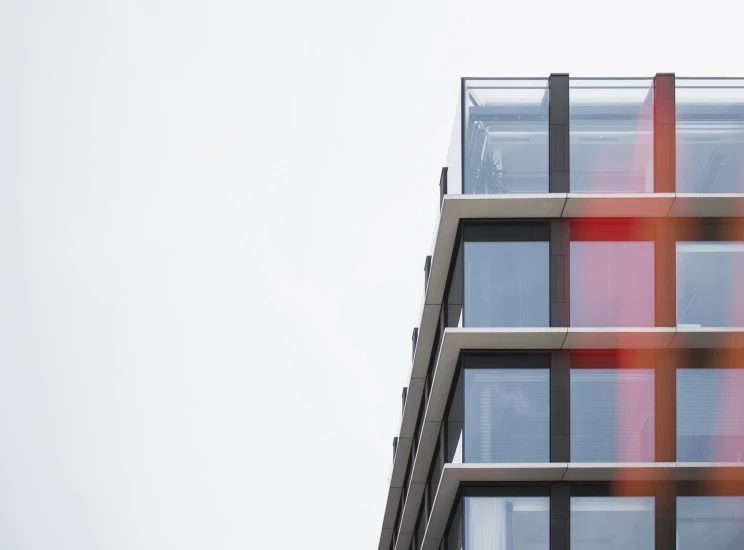 an orange red and black pattern is on the side of the building