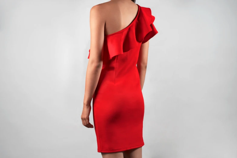 a woman in a red dress is looking at soing