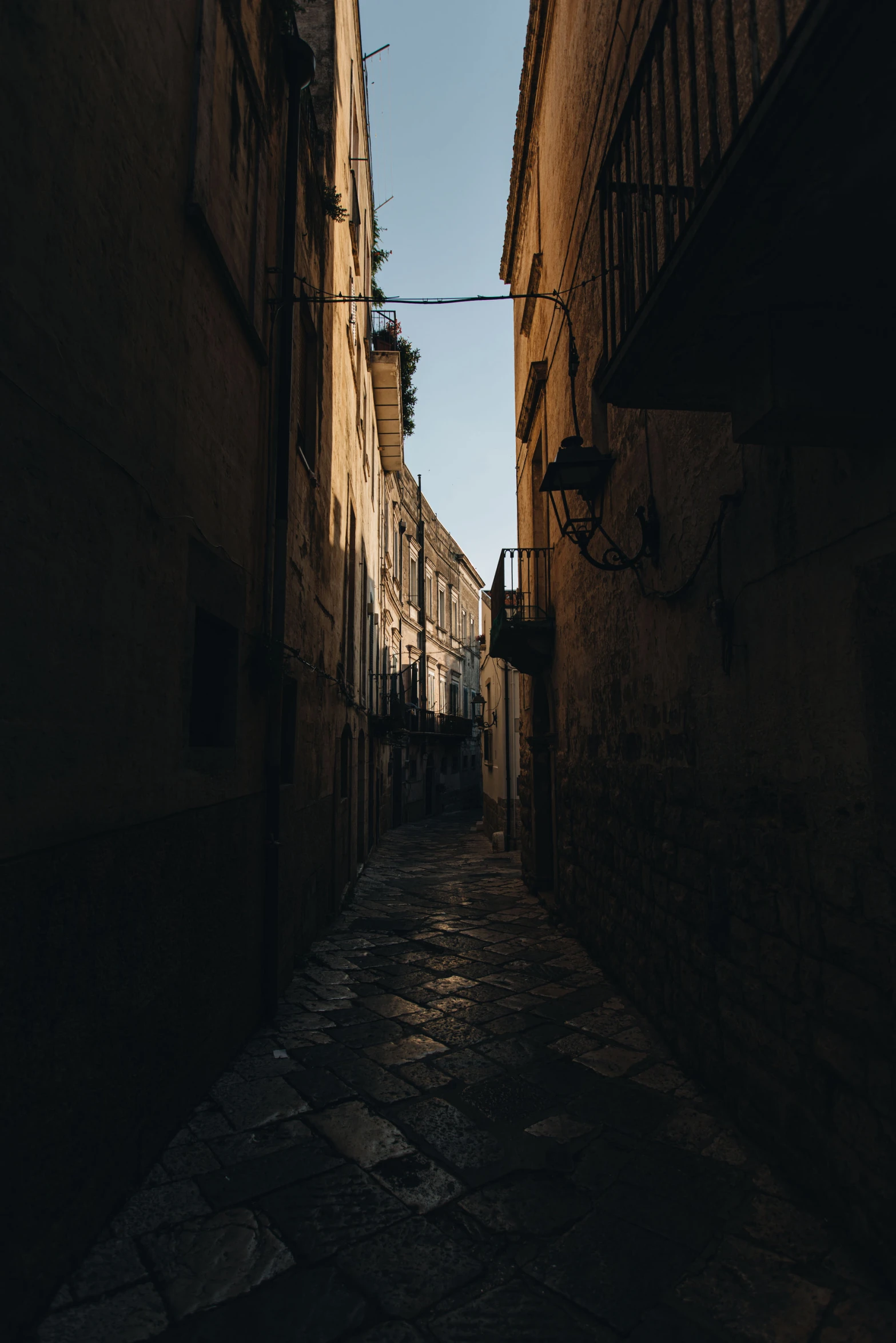 a narrow street that is lined with stone buildings