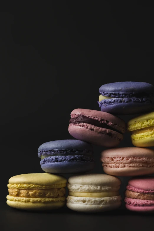 there are many different macaroons on the table