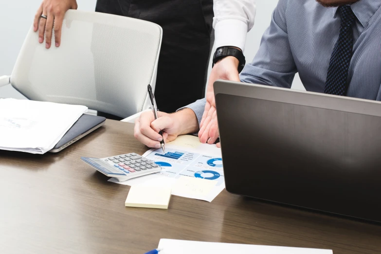 two business people working on a project in an office