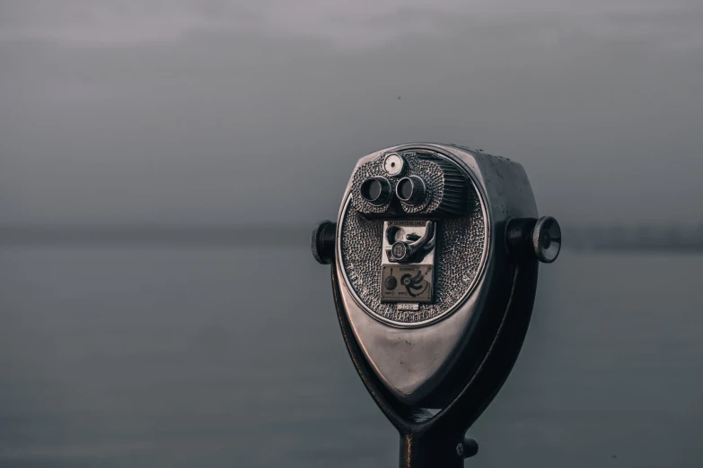 an old fashioned coin operated object in the water