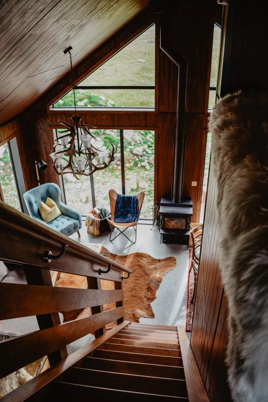 an airy view of a stairway leading up to the loft