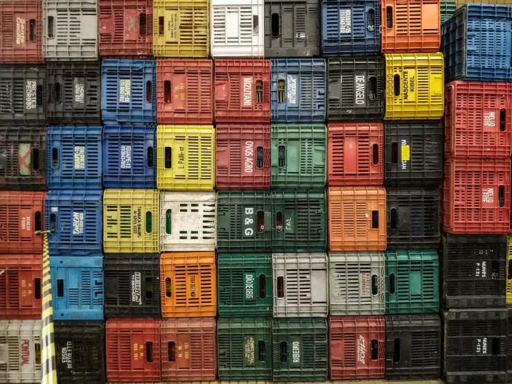 multi colored containers stacked on one another