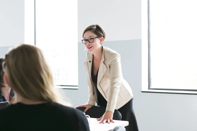 a woman is standing up with her hands out