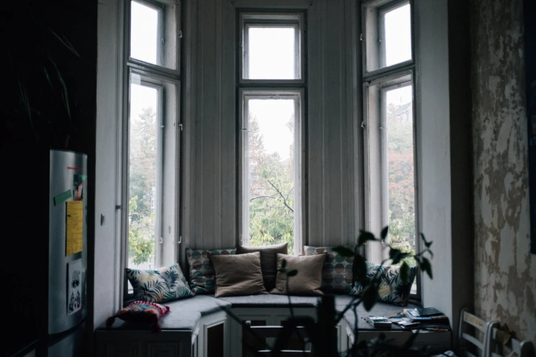 a sofa is set up in the corner of the room