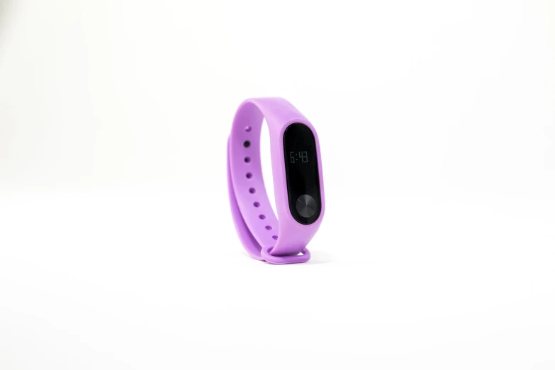 a purple fitbit 2 band on white background