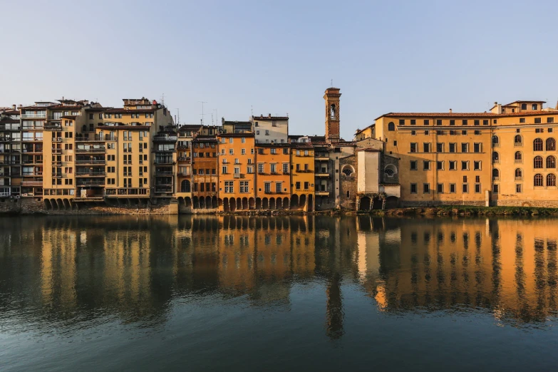 buildings on the edge of water with reflections