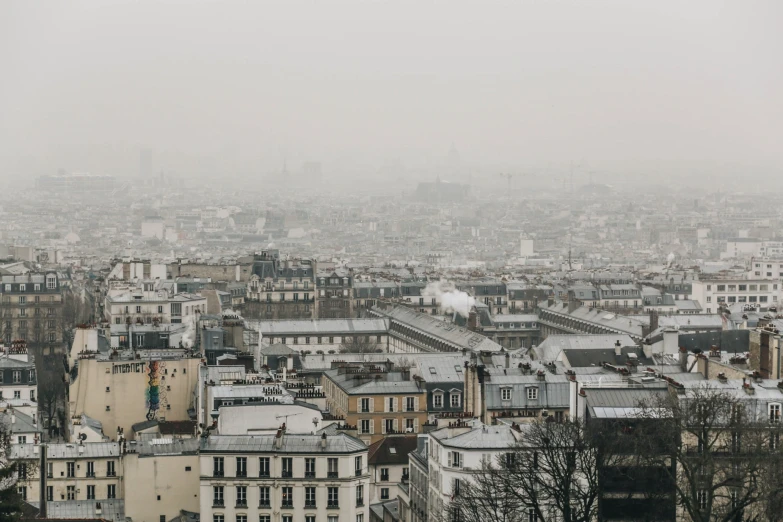 the city skyline of a european city is shroud by thick fog