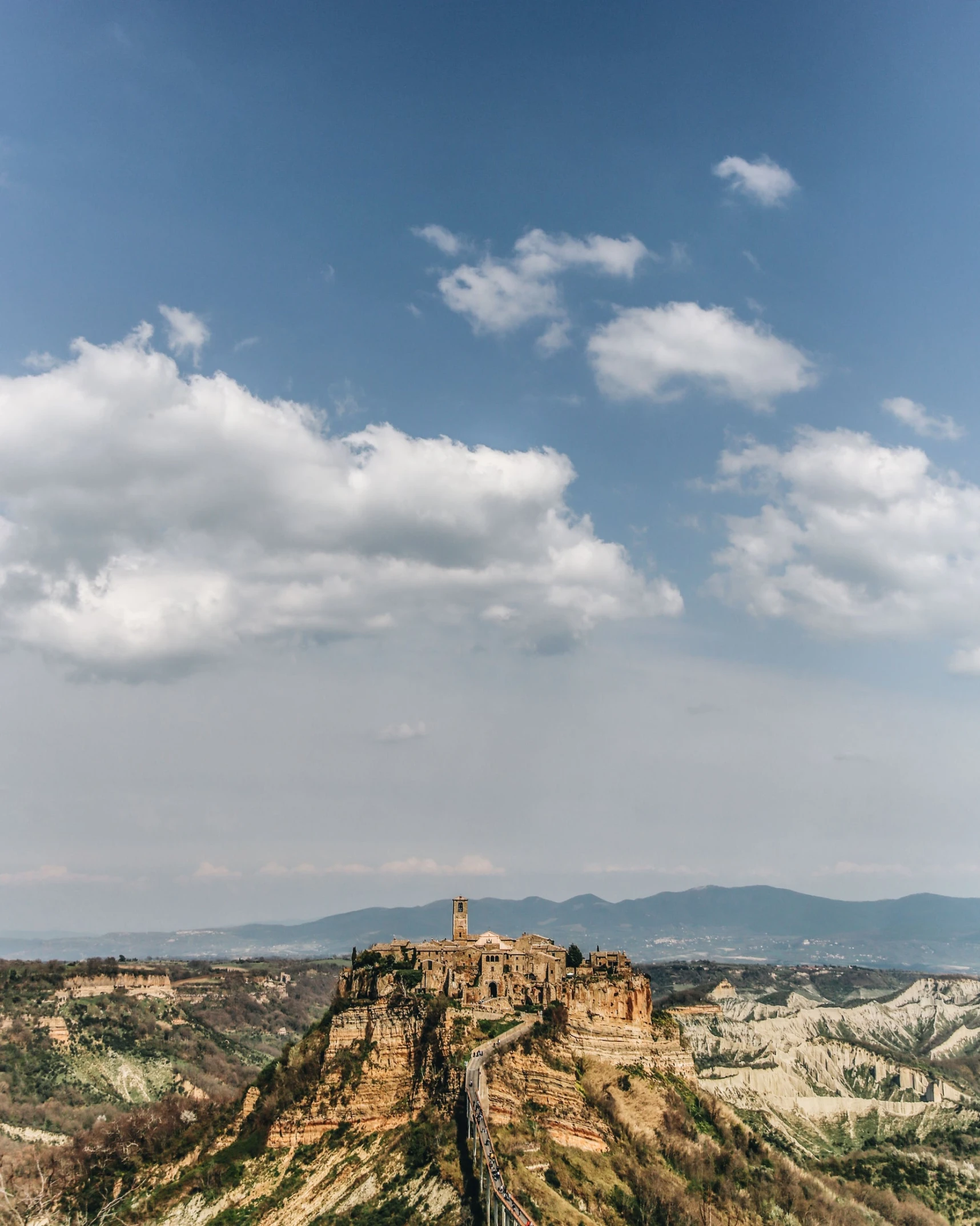 a scenic view of a castle with many towers on it