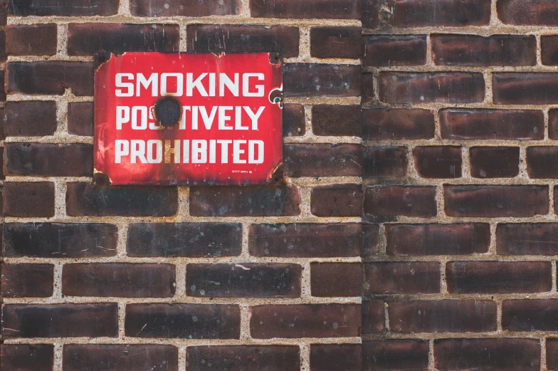 a red sign that is on a wall