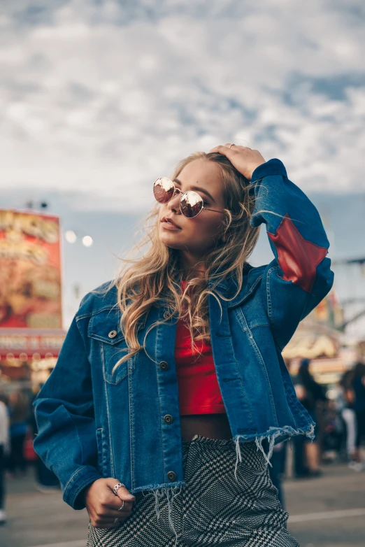 a woman wearing sunglasses posing for the camera