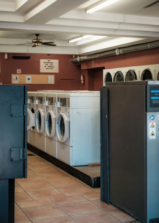 a bathroom with washing machines and other items in it