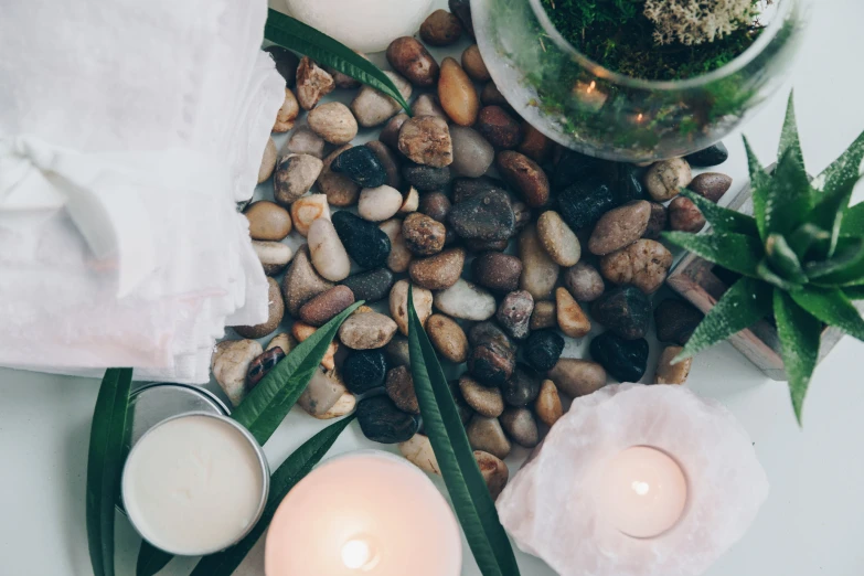 stones, leaves and candles with a candle holder