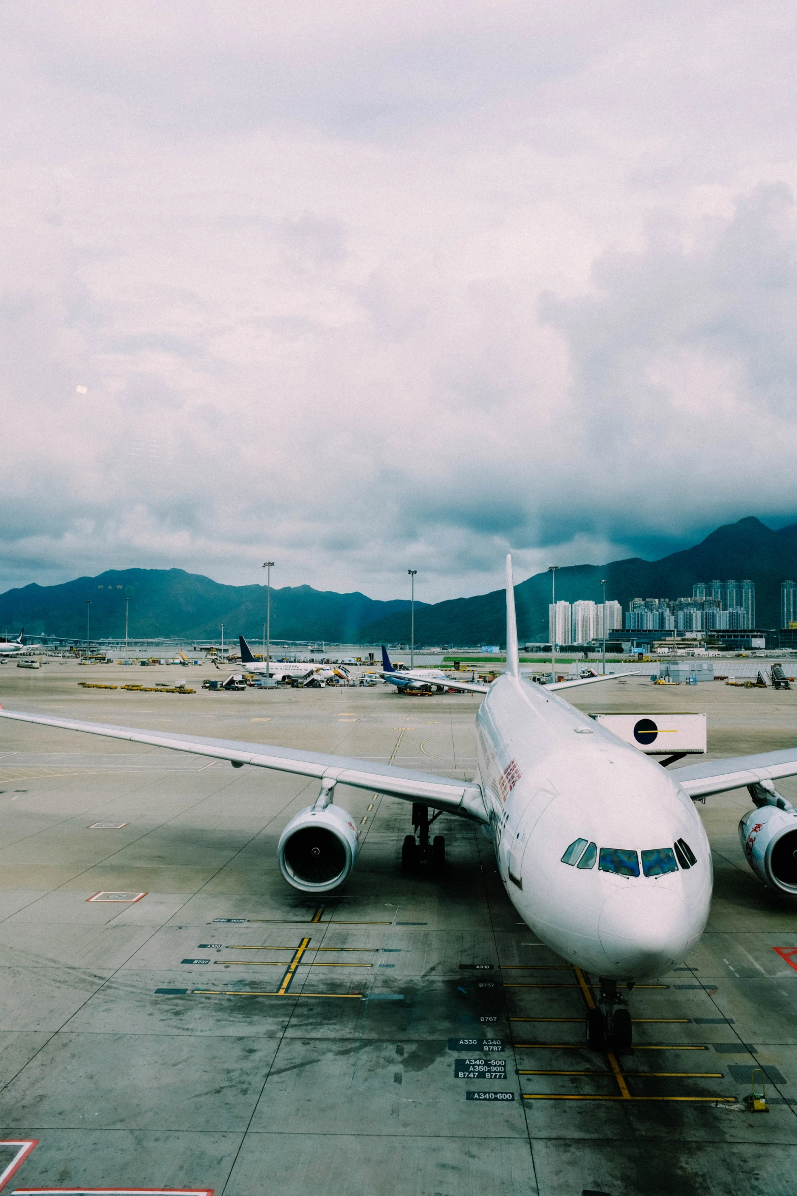 a large white plane parked in a parking lot