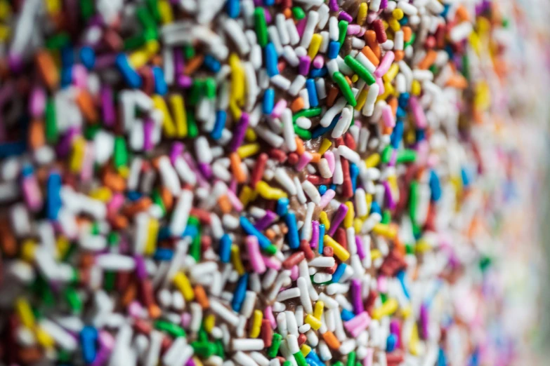 a sprinkle that looks like multi - colored doughnuts