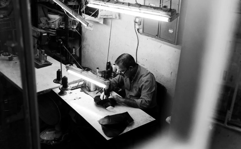 a man works on some type of workbench