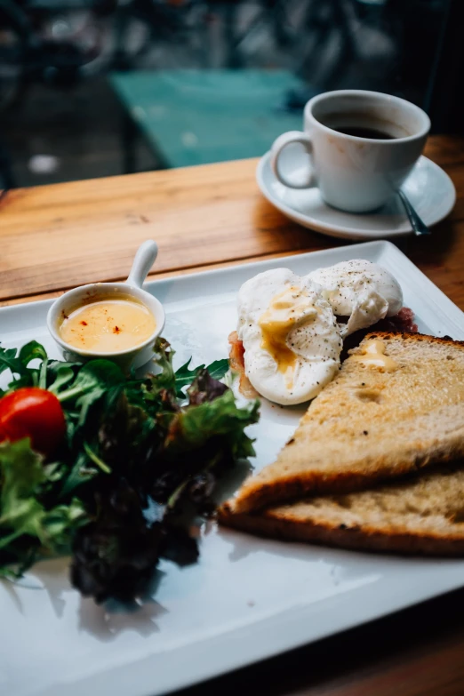 a meal is served on a plate at a restaurant