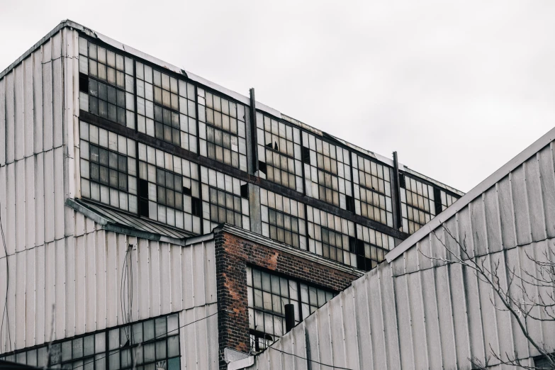 the side of an older brick building with windows