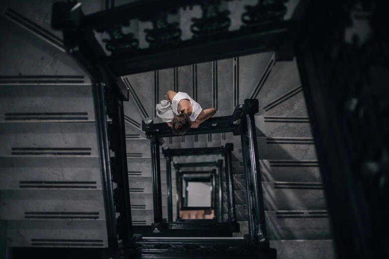 a man riding a skateboard down a set of stairs