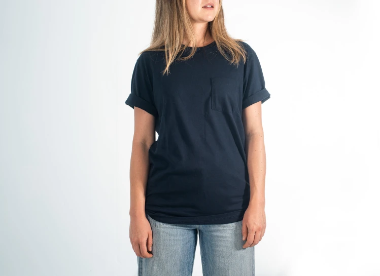 a woman wearing a black t - shirt and jeans