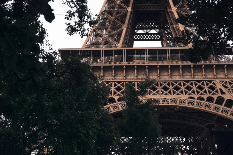 the very high and slender, bronzed replica of the eiffel tower