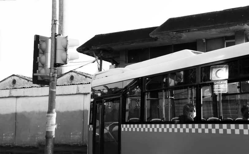 a black and white po of a bus that is pulled over