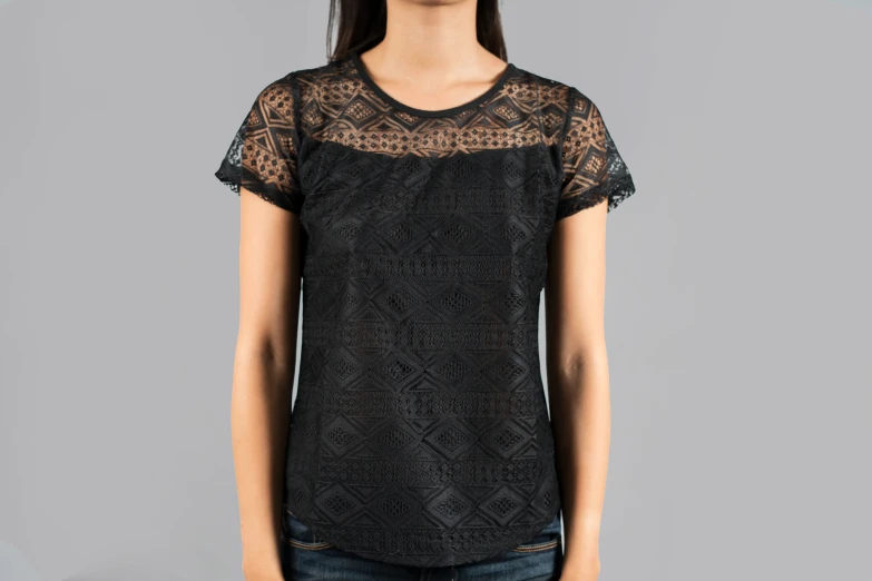 the shirt features lace detailing and delicate sheer fabric