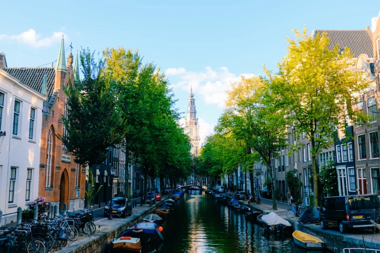 boats on a canal in the middle of a city